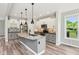 Contemporary kitchen boasts granite island, stainless steel appliances, and modern finishes at 644 Ridge Gate Dr, Brownsburg, IN 46112