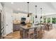Charming kitchen with pendant lighting, an island with seating, and modern appliances at 644 Ridge Gate Dr, Brownsburg, IN 46112
