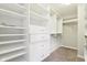 Spacious walk-in closet featuring custom shelving, drawers, and ample storage at 644 Ridge Gate Dr, Brownsburg, IN 46112