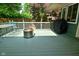 Outdoor deck featuring outdoor furniture, grilling area, and lush greenery at 6550 Sunset Ln, Indianapolis, IN 46260