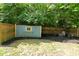 A quaint fenced backyard featuring a firepit and outdoor seating, perfect for gatherings at 6550 Sunset Ln, Indianapolis, IN 46260