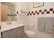 This bathroom features updated vanity, fixtures and lighting at 6550 Sunset Ln, Indianapolis, IN 46260