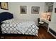 Comfortable bedroom with built in desk area, decor, and natural lighting at 6550 Sunset Ln, Indianapolis, IN 46260