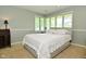 Serene bedroom with neutral tones, ample natural light, and a comfortable bed at 6550 Sunset Ln, Indianapolis, IN 46260