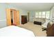 Large bedroom with ample natural light, seating and closet access at 6550 Sunset Ln, Indianapolis, IN 46260