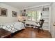 Cozy bedroom featuring built-in shelves, a desk area, and a comfortable bed at 6550 Sunset Ln, Indianapolis, IN 46260