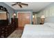 This bedroom features hardwood floors, closet and window with custom blinds at 6550 Sunset Ln, Indianapolis, IN 46260