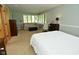 Spacious bedroom with a sitting area, large windows, and ample space at 6550 Sunset Ln, Indianapolis, IN 46260