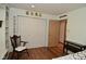 Bedroom with a double door closet and an open doorway at 6550 Sunset Ln, Indianapolis, IN 46260