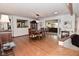 Elegant dining room open to living room featuring hardwood floors at 6550 Sunset Ln, Indianapolis, IN 46260