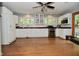 This bright kitchen features white cabinets, black countertops, and a stainless-steel oven at 6550 Sunset Ln, Indianapolis, IN 46260