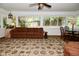 Cozy living room with large windows, a patterned sofa, and a decorative area rug at 6550 Sunset Ln, Indianapolis, IN 46260