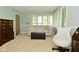 Bright living room with neutral decor, large windows, and comfortable seating arrangement at 6550 Sunset Ln, Indianapolis, IN 46260