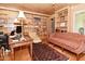 Cozy office space featuring wood paneled walls and built-in bookshelves at 6550 Sunset Ln, Indianapolis, IN 46260