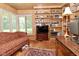 Cozy office space featuring wood paneled walls and built-in bookshelves at 6550 Sunset Ln, Indianapolis, IN 46260