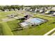 Aerial shot of a community pool area with a pool house, ample seating, and manicured landscaping at 6857 Jacone Dr, Brownsburg, IN 46112