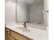Bathroom featuring a modern sink with a light wood cabinet, a marble-style countertop, and sleek hardware at 8338 Hunters Meadow Way, Indianapolis, IN 46259