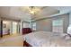 Spacious bedroom with a large bed, neutral tones, and access to a closet and bathroom at 8338 Hunters Meadow Way, Indianapolis, IN 46259