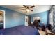 Inviting bedroom with a calming ambiance, dedicated desk area, and a ceiling fan at 8338 Hunters Meadow Way, Indianapolis, IN 46259