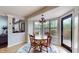Cozy breakfast nook with a round table, bay window, and a door to the outside at 8338 Hunters Meadow Way, Indianapolis, IN 46259