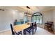 Cozy dining room featuring a modern light fixture and arched window at 8338 Hunters Meadow Way, Indianapolis, IN 46259