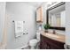 Bathroom featuring modern vanity with granite countertop, framed mirror, and shower-tub combo at 8416 Buckingham Dr, Columbus, IN 47201