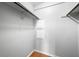 Empty closet with upper shelving and hardwood floors at 8416 Buckingham Dr, Columbus, IN 47201