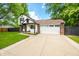Two-story home with brick and siding, attached garage and inviting curb appeal at 8416 Buckingham Dr, Columbus, IN 47201