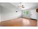 Spacious living room with hardwood floors, a window, and a blank wall at 8416 Buckingham Dr, Columbus, IN 47201