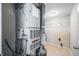 Utility room with tile flooring, furnace, and hot water heater at 8416 Buckingham Dr, Columbus, IN 47201