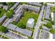 An aerial shot showcasing the community's layout, green spaces, parking, and a central pool area at 8503 Canterbury W Sq # D, Indianapolis, IN 46260
