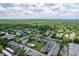 Sprawling aerial shot showing the community nestled among dense trees, with well-organized residential buildings and parking at 8503 Canterbury W Sq # D, Indianapolis, IN 46260