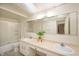 Bathroom featuring double sinks, a large mirror, and a shower/tub combo at 8503 Canterbury W Sq # D, Indianapolis, IN 46260