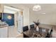 Dining area adjacent to the kitchen with modern appliances and views into the living area at 8503 Canterbury W Sq # D, Indianapolis, IN 46260
