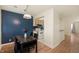 Open dining area next to a kitchen featuring a modern table and chairs at 8503 Canterbury W Sq # D, Indianapolis, IN 46260