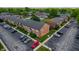 Aerial shot of a brick residential building with designated parking and greenery, situated in a community setting at 8503 Canterbury W Sq # D, Indianapolis, IN 46260