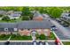 Aerial view of a brick residential building with well-maintained landscaping and ample parking at 8503 Canterbury W Sq # D, Indianapolis, IN 46260