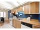 Kitchen featuring oak cabinets, modern appliances, and a breakfast nook at 8503 Canterbury W Sq # D, Indianapolis, IN 46260