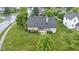 Well-maintained home featuring a large, lush green lawn and mature landscaping at 8599 Lansdowne Dr, Fishers, IN 46038