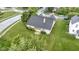 Well-maintained home featuring a large, lush green lawn and mature landscaping at 8599 Lansdowne Dr, Fishers, IN 46038