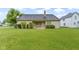 Lush backyard featuring a well-maintained lawn and tasteful landscaping at 8599 Lansdowne Dr, Fishers, IN 46038