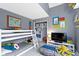 Fun bedroom with bunk beds, a TV, and plenty of play space at 8599 Lansdowne Dr, Fishers, IN 46038