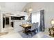 Dining room with modern chandelier and view to the kitchen at 8599 Lansdowne Dr, Fishers, IN 46038