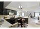 Kitchen with an island cart and open view to the living area at 8599 Lansdowne Dr, Fishers, IN 46038