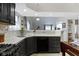 Kitchen sink and countertops with a view to the living room at 8599 Lansdowne Dr, Fishers, IN 46038