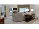 Comfortable living room featuring a fireplace, modern lighting, and a glimpse of the dining area at 8599 Lansdowne Dr, Fishers, IN 46038