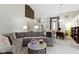 Large living area with modern decor, vaulted ceilings, open layout, and view to the office at 8599 Lansdowne Dr, Fishers, IN 46038