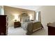Warm and inviting main bedroom with great lighting and soft color palette at 8599 Lansdowne Dr, Fishers, IN 46038