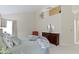Bright main bedroom with vaulted ceilings, neutral walls, and dark wood dresser at 8599 Lansdowne Dr, Fishers, IN 46038