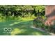 The home's lush, well-maintained backyard is an outdoor sanctuary for relaxation at 865 Countryside Ln, Columbus, IN 47201